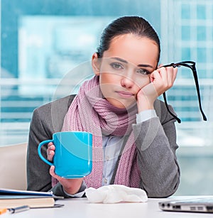 Young businesswoman sick in the office