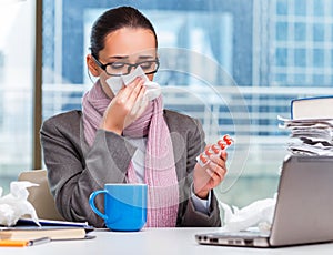 Young businesswoman sick in the office