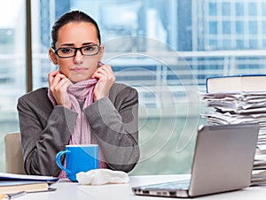 Young businesswoman sick in the office