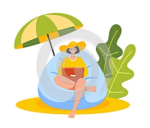 Young Businesswoman Sitting in Beanbag Chair on Tropical Beach. Woman Freelancer Work on Laptop under Umbrella