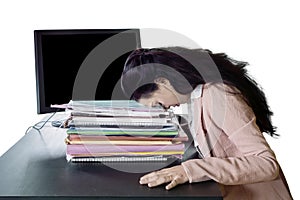 Young businesswoman sleeping above documents