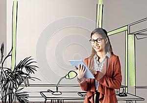 young businesswoman smiling with tablet in front of the blueprint of the new office