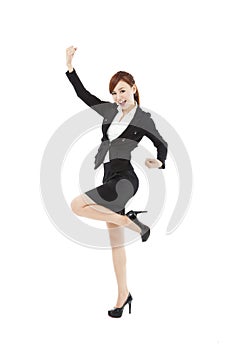 Young businesswoman with success gesture