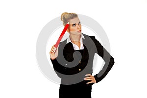 Young businesswoman thinking with big pen