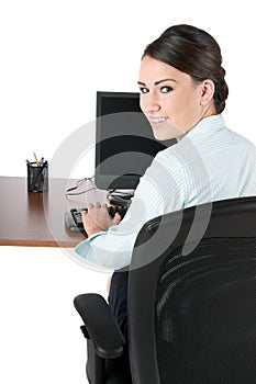 Young businesswoman typing, isolated on white