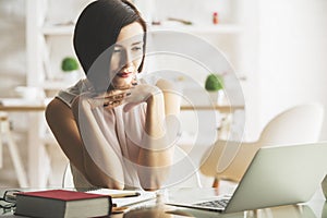 Young businesswoman using laptop photo