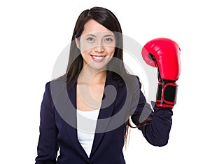 Young businesswoman wear of plastic boxing gloves