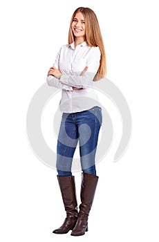 Young businesswoman in white shirt standing with crossed arms