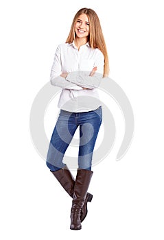 Young businesswoman in white shirt standing with crossed arms