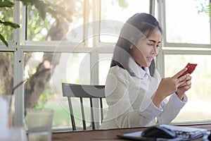 Young businesswoman working in coffee shop