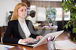 Young businesswoman working on a computer in the office