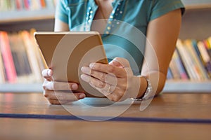 Young businesswoman working with digital tablet.