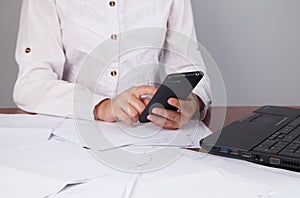 Young businesswoman working on laptop in office