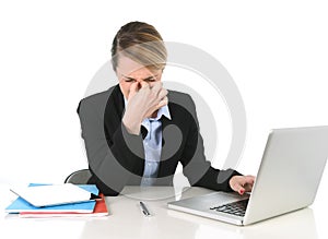 Young businesswoman working in stress and headache at office computer frustrated