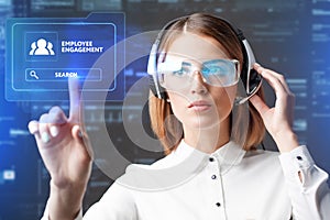 Young businesswoman working in virtual glasses, select the icon employee engagement on the virtual display