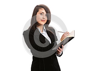 Young businesswoman writing in notebook
