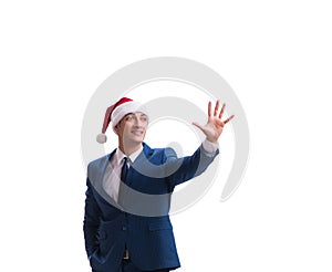 Young busnessman wearing santa hat in christmas concept on white