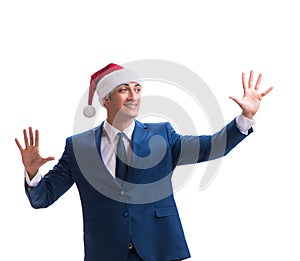 Young busnessman wearing santa hat in christmas concept on white