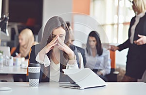 Young busy beautiful latin business woman suffering stress working at office computer