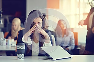 Young busy beautiful latin business woman suffering stress working at office computer