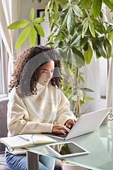 Young busy woman using laptop pc elearning online, searching job.