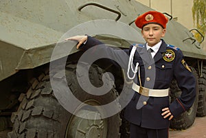 Young cadet with an armored troop carrier