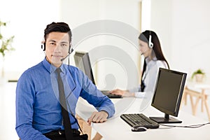 Young call center agent working in office