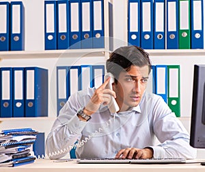 Young call center operator speaking on phone