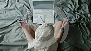 Young calm woman relaxing meditating with laptop at home, meditating with eyes closed for increasing productivity at