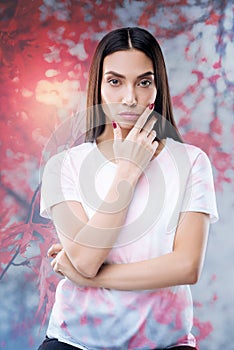 Young calm woman sitting alone and thinking about changing the job