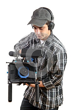 Young cameraman with movie camera