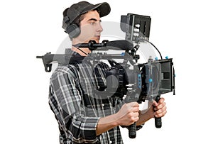 Young cameraman with movie camera