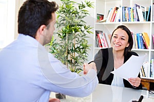 Handshake after successful job interview and cv photo