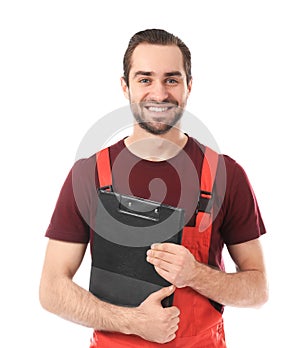 Young car mechanic with clipboard on white background