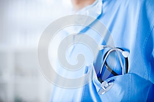 Young cardiologist with stethoscope in his pocket