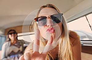 Young and carefree. an attractive young woman making silly faces during her road trip through Italy.