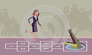 Young carefree businesswoman playing hopscotch, crocodile in front photo