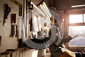Carpenter writing plan in workshop
