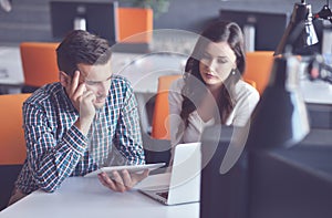 Young Casual business couple using computer in the office. Coworking, Creative manager showing new startup idea