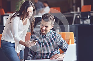 Young Casual business couple using computer in the office. Coworking, Creative manager showing new startup idea