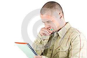 Young casual businessman writing