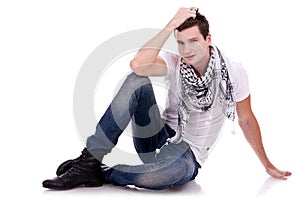 Young casual happy man seated