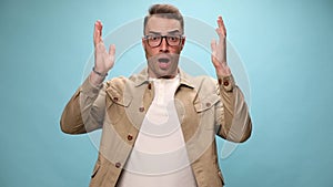 young casual man on blue background