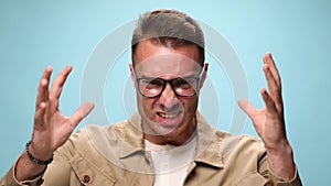 young casual man on blue background