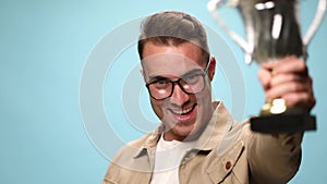 young casual man on blue background