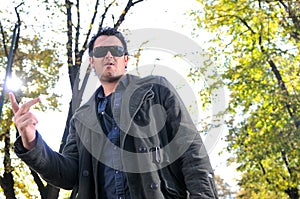 Young casual man outdoor portrait posing