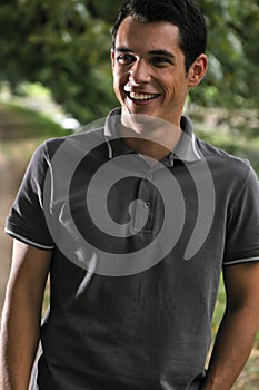 Young casual man outdoor portrait smiling