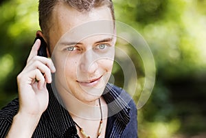 Young casual man on phone