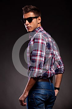 Young casual man with shades