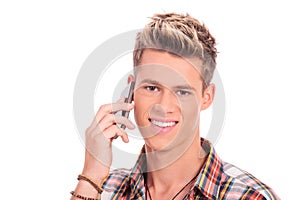 Young casual man speaking on phone